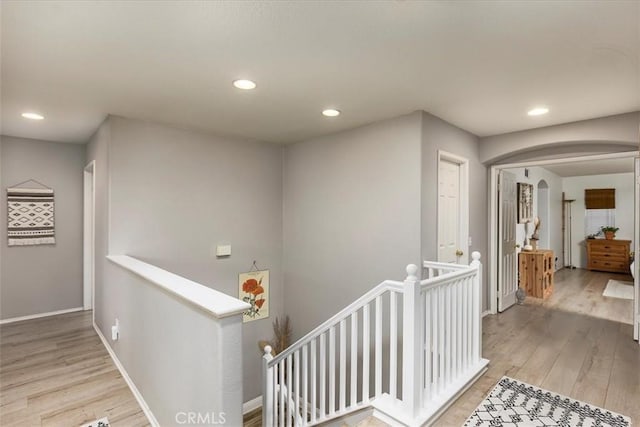 41028 Promenade Chardonnay Hls, Temecula, CA 92591 - corridor with an upstairs landing, light wood-type flooring, recessed lighting, arched walkways, and baseboards