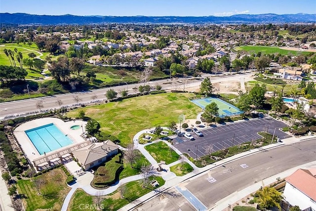 41028 Promenade Chardonnay Hls, Temecula, CA 92591 - aerial overview of property's location with a pool area and a mountainous background