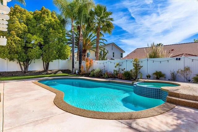 41028 Promenade Chardonnay Hls, Temecula, CA 92591 - view of pool featuring a fenced backyard, a pool with connected hot tub, and a patio
