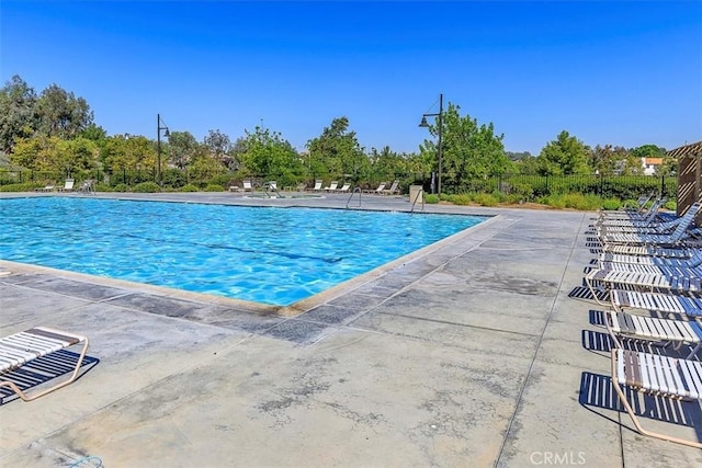 community pool with a patio area