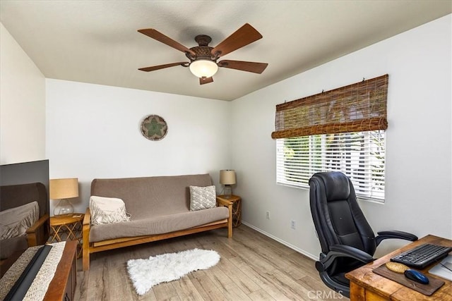 office with baseboards, ceiling fan, and wood finished floors