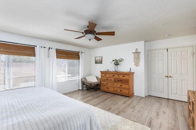 41028 Promenade Chardonnay Hls, Temecula, CA 92591 - bedroom featuring light wood-style floors, a ceiling fan, a closet, and baseboards