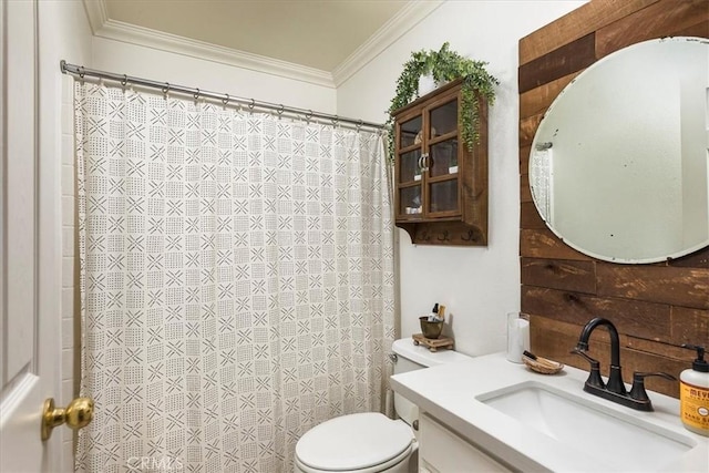 bathroom with crown molding, a shower with shower curtain, toilet, and vanity