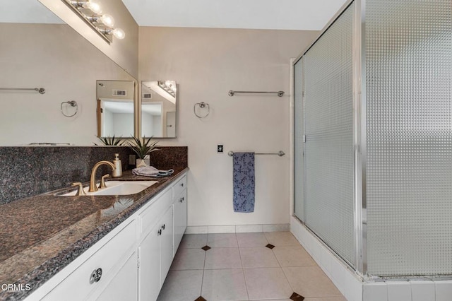 1530 Calle Portada, Camarillo, CA 93010 - bathroom with baseboards, a shower stall, tile patterned flooring, and vanity