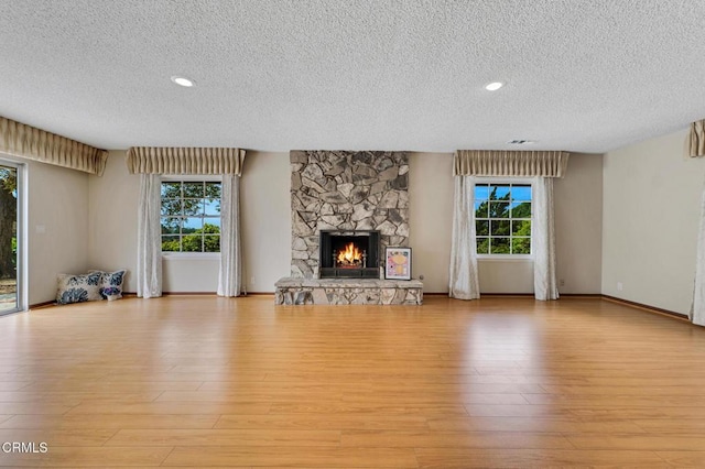1530 Calle Portada, Camarillo, CA 93010 - unfurnished living room with a textured ceiling and light wood-type flooring