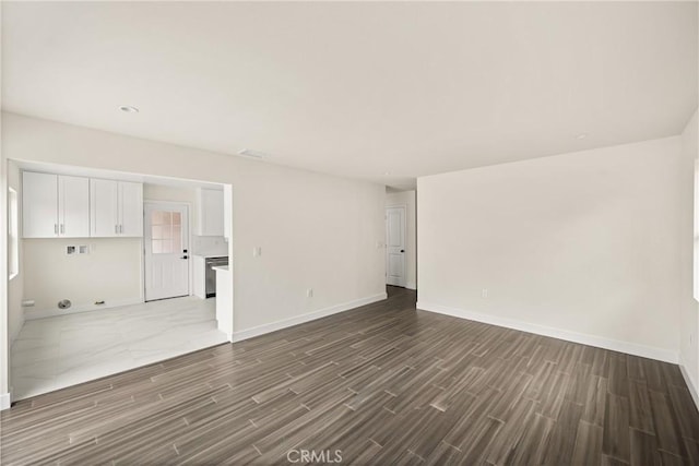 interior space with baseboards and wood tiled floor