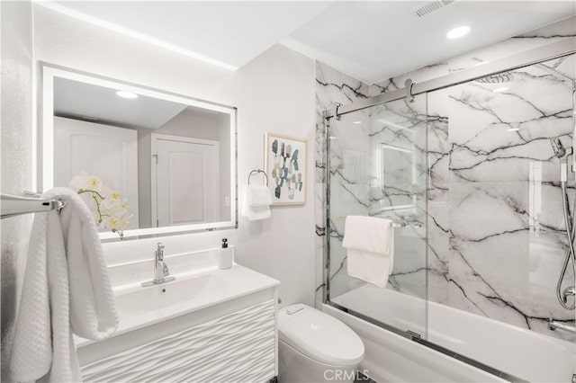 12 Whitewood Way, Irvine, CA 92612 - bathroom featuring visible vents, vanity, toilet, shower / bath combination with glass door, and recessed lighting