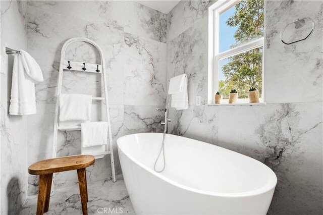 12 Whitewood Way, Irvine, CA 92612 - full bath with a freestanding bath, tile walls, stone wall, and marble finish floor
