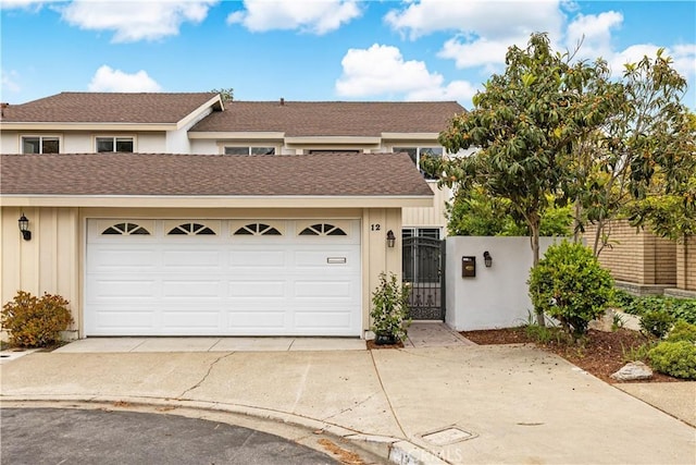 12 Whitewood Way, Irvine, CA 92612 - view of front of house featuring a gate, board and batten siding, fence, and driveway