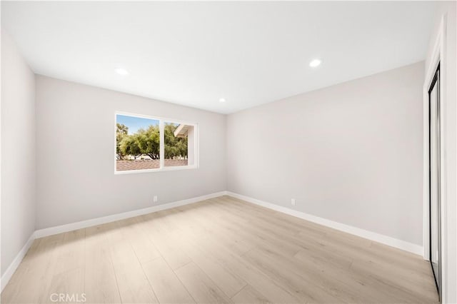 12 Whitewood Way, Irvine, CA 92612 - spare room featuring recessed lighting, baseboards, and light wood-type flooring