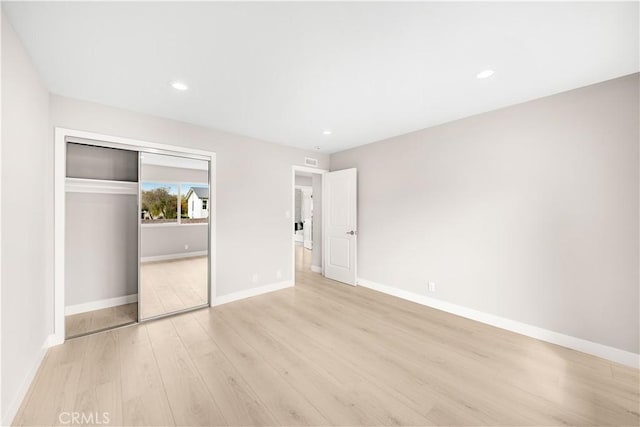12 Whitewood Way, Irvine, CA 92612 - unfurnished bedroom with recessed lighting, baseboards, light wood-style flooring, and a closet