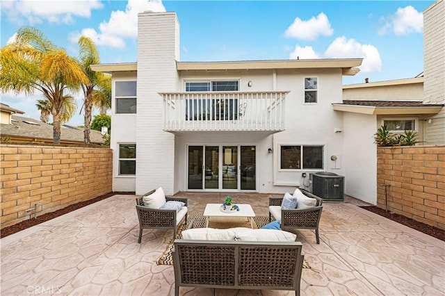 12 Whitewood Way, Irvine, CA 92612 - back of property with central air condition unit, a patio, a balcony, and stucco siding