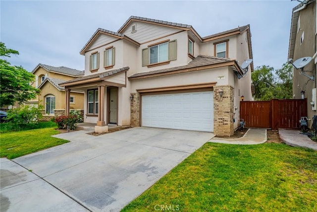 3882 Strand Way, Perris, CA 92571 - view of front of home featuring a garage, stucco siding, driveway, brick siding, and a tiled roof