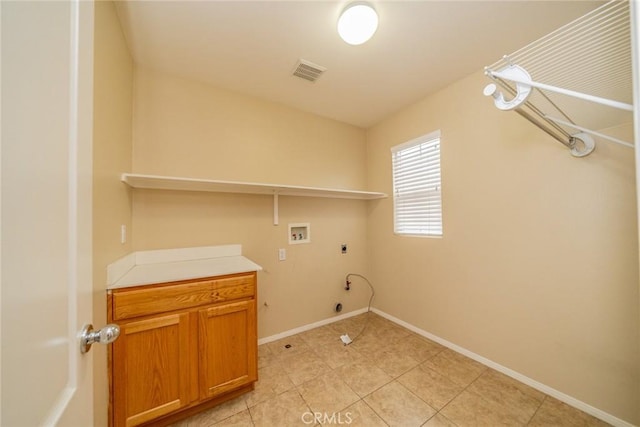 3882 Strand Way, Perris, CA 92571 - clothes washing area with electric dryer hookup, washer hookup, light tile patterned floors, baseboards, and gas dryer hookup