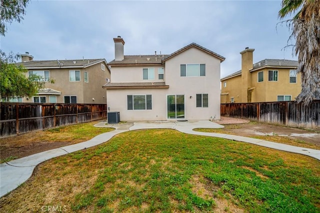 3882 Strand Way, Perris, CA 92571 - rear view of property featuring cooling unit, a patio area, stucco siding, and a chimney
