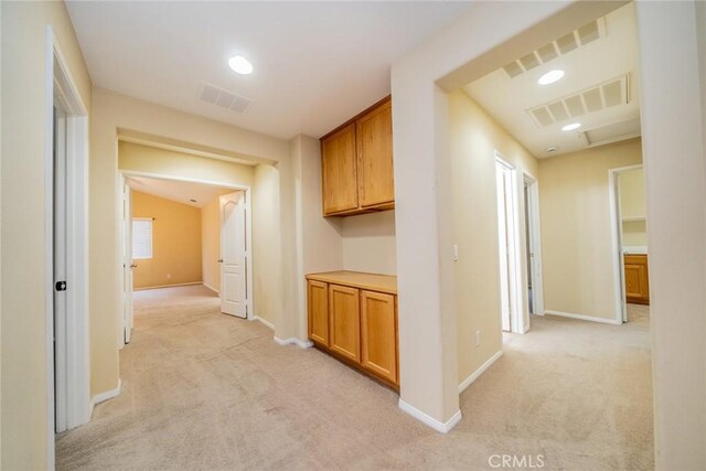 3882 Strand Way, Perris, CA 92571 - hallway featuring light carpet, baseboards, and recessed lighting
