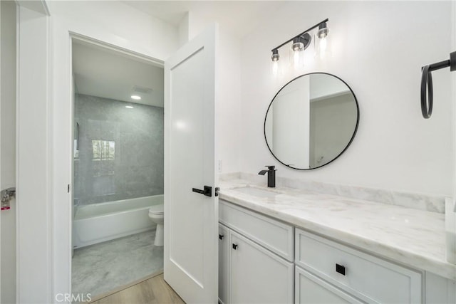 7314 Quill Dr Unit 155, Downey, CA 90242 - bathroom with wood finished floors, vanity, tub / shower combination, and toilet