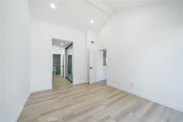 7314 Quill Dr Unit 155, Downey, CA 90242 - spare room featuring high vaulted ceiling, baseboards, beam ceiling, and light wood-type flooring
