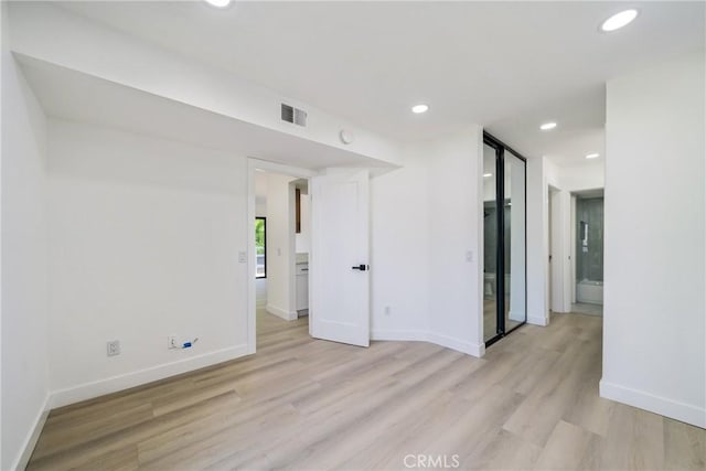 7314 Quill Dr Unit 155, Downey, CA 90242 - unfurnished room featuring recessed lighting, visible vents, light wood finished floors, and baseboards