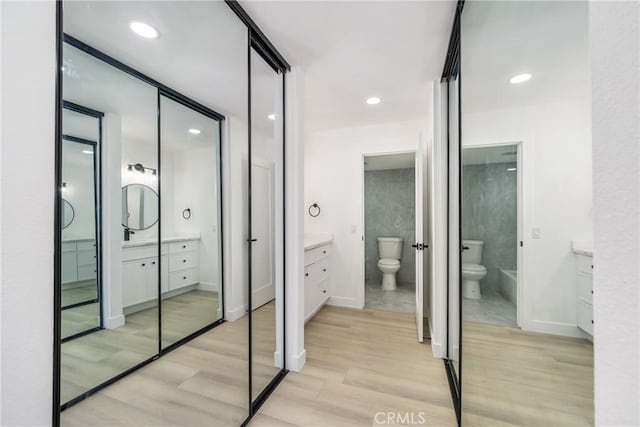 7314 Quill Dr Unit 155, Downey, CA 90242 - full bath with wood finished floors, toilet, and vanity