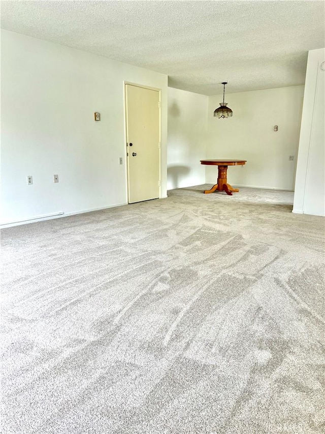 61 Calle Cadiz Unit Q, Laguna Woods, CA 92530 - empty room with carpet flooring, a textured ceiling, and billiards table