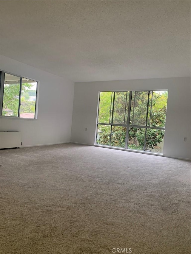 61 Calle Cadiz Unit Q, Laguna Woods, CA 92530 - carpeted spare room with a textured ceiling