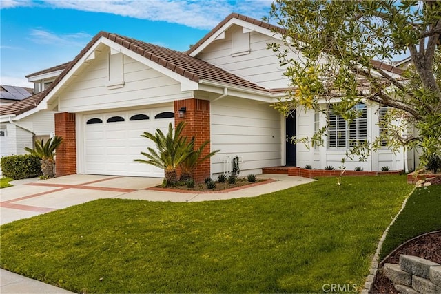 2122 Via Aguila, San Clemente, CA 92673 - view of front facade featuring a tile roof, brick siding, a garage, a front yard, and concrete driveway