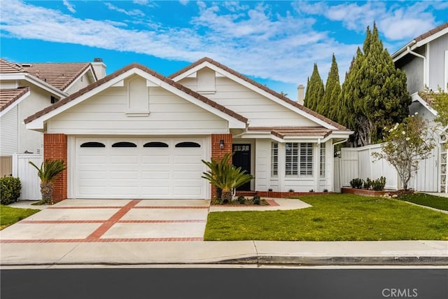 2122 Via Aguila, San Clemente, CA 92673 - view of front of property with concrete driveway, brick siding, an attached garage, and fence