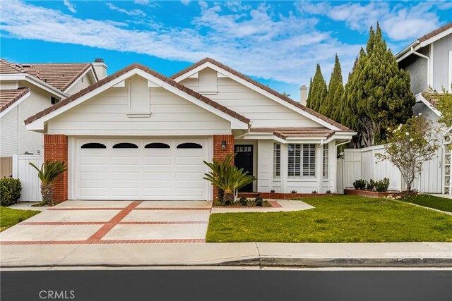 2122 Via Aguila, San Clemente, CA 92673 - ranch-style house featuring driveway, an attached garage, brick siding, and a tile roof