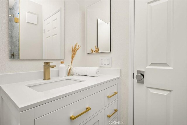 2122 Via Aguila, San Clemente, CA 92673 - bathroom featuring vanity and a shower with door