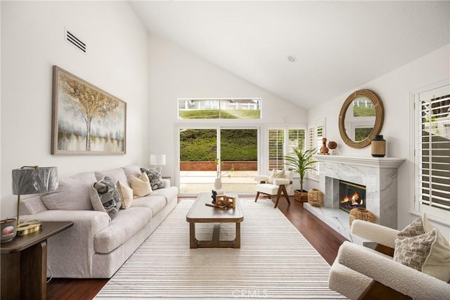 2122 Via Aguila, San Clemente, CA 92673 - living room with a premium fireplace, dark wood-style floors, and high vaulted ceiling