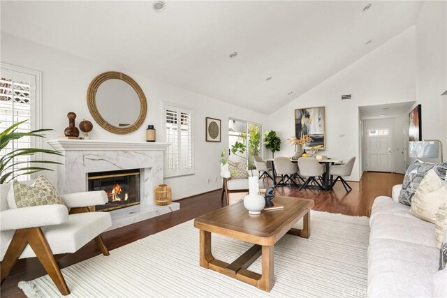 2122 Via Aguila, San Clemente, CA 92673 - living area featuring a fireplace, wood finished floors, and high vaulted ceiling