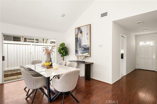 2122 Via Aguila, San Clemente, CA 92673 - dining area with wood finished floors, vaulted ceiling, and baseboards