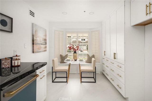 2122 Via Aguila, San Clemente, CA 92673 - kitchen with light marble finish floors, dishwasher, white cabinets, and dark countertops