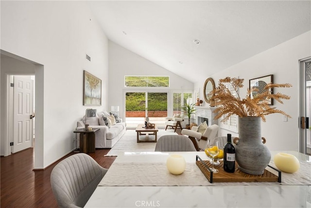 2122 Via Aguila, San Clemente, CA 92673 - dining space featuring high vaulted ceiling, dark wood-style flooring, baseboards, and a fireplace