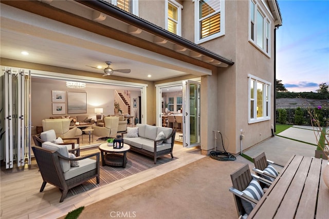view of patio with ceiling fan and an outdoor hangout area