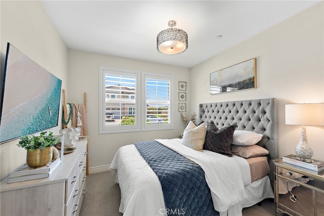 carpeted bedroom with baseboards