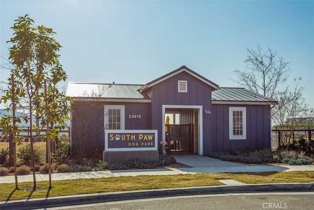 view of building exterior featuring fence