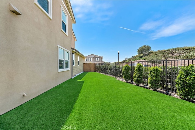 view of yard with a fenced backyard