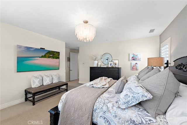 carpeted bedroom with a notable chandelier, baseboards, and visible vents