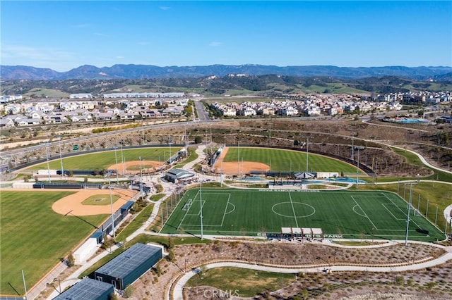 drone / aerial view featuring a residential view and a mountain view