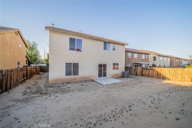14051 Mare Ln, Victorville, CA 92394 - back of house featuring a fenced backyard, stucco siding, and a residential view
