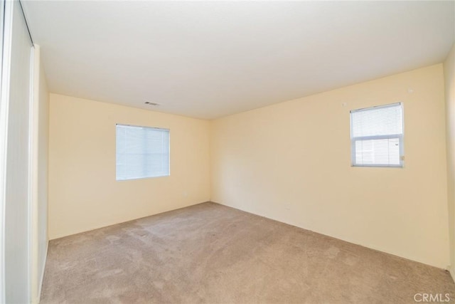 14051 Mare Ln, Victorville, CA 92394 - spare room with light carpet
