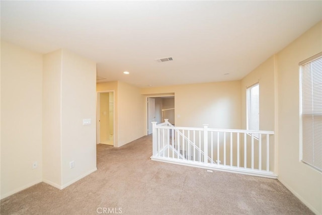 14051 Mare Ln, Victorville, CA 92394 - empty room featuring light carpet and recessed lighting