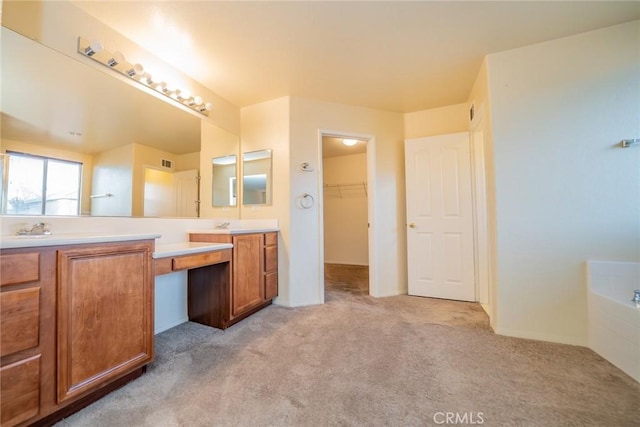 14051 Mare Ln, Victorville, CA 92394 - full bathroom featuring double vanity, carpet floors, a bath, and a walk in closet