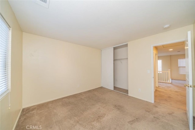 14051 Mare Ln, Victorville, CA 92394 - unfurnished bedroom with light carpet and a closet
