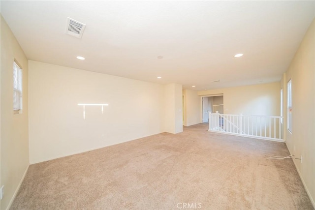 14051 Mare Ln, Victorville, CA 92394 - empty room with light colored carpet and recessed lighting