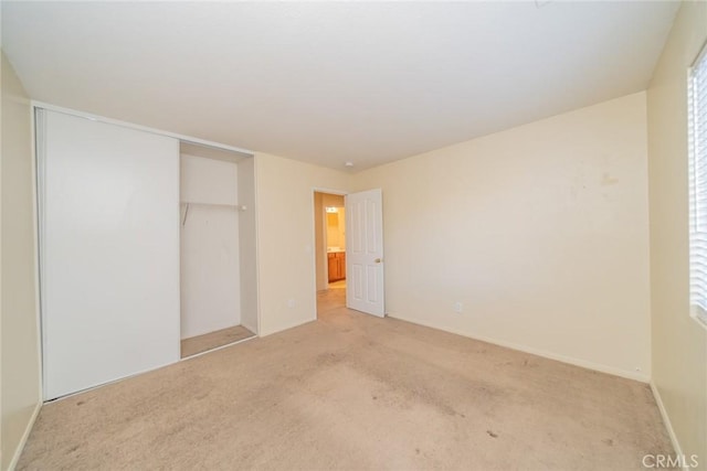 14051 Mare Ln, Victorville, CA 92394 - unfurnished bedroom featuring light colored carpet and a closet