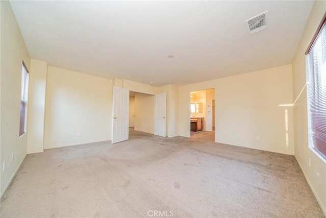 14051 Mare Ln, Victorville, CA 92394 - spare room featuring light carpet