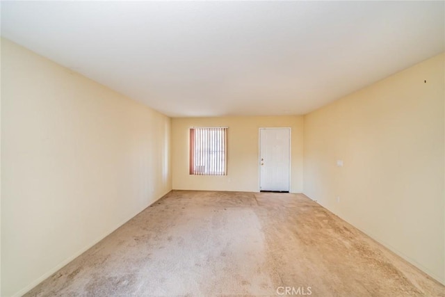 14051 Mare Ln, Victorville, CA 92394 - empty room with light carpet